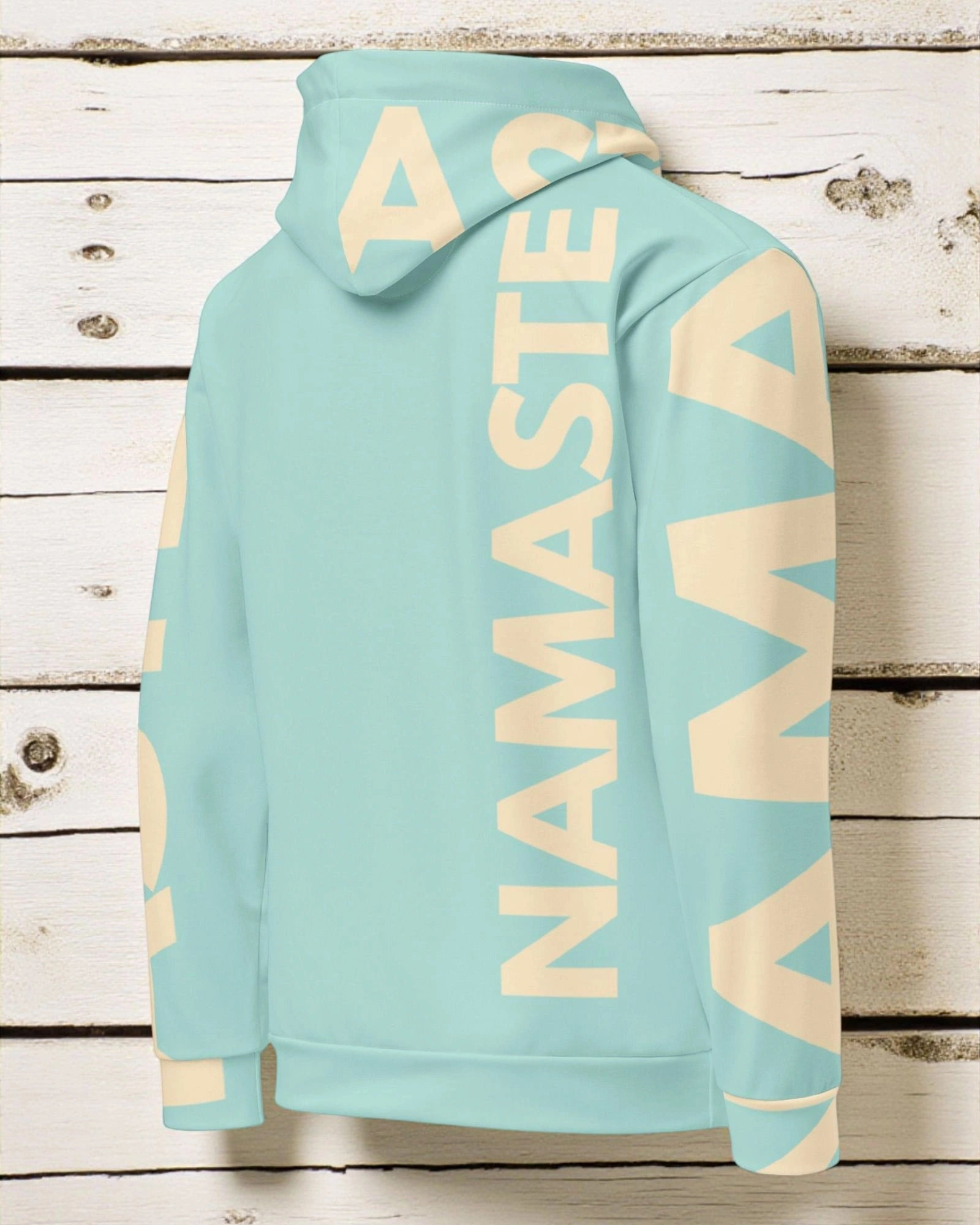 „Flauschiger, sanfter und warmer Damen-Hoodie in Mint und Sand mit ‚Namaste‘-Design – Goodsein Allover Hoodie Woman.“detail