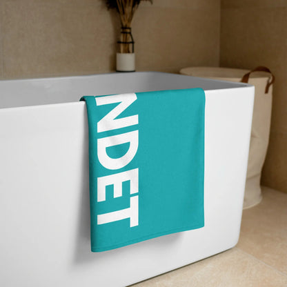 Goldsein Strandtuch "Gestrandet" in Türkis. Bequem, soft und modern im Design.