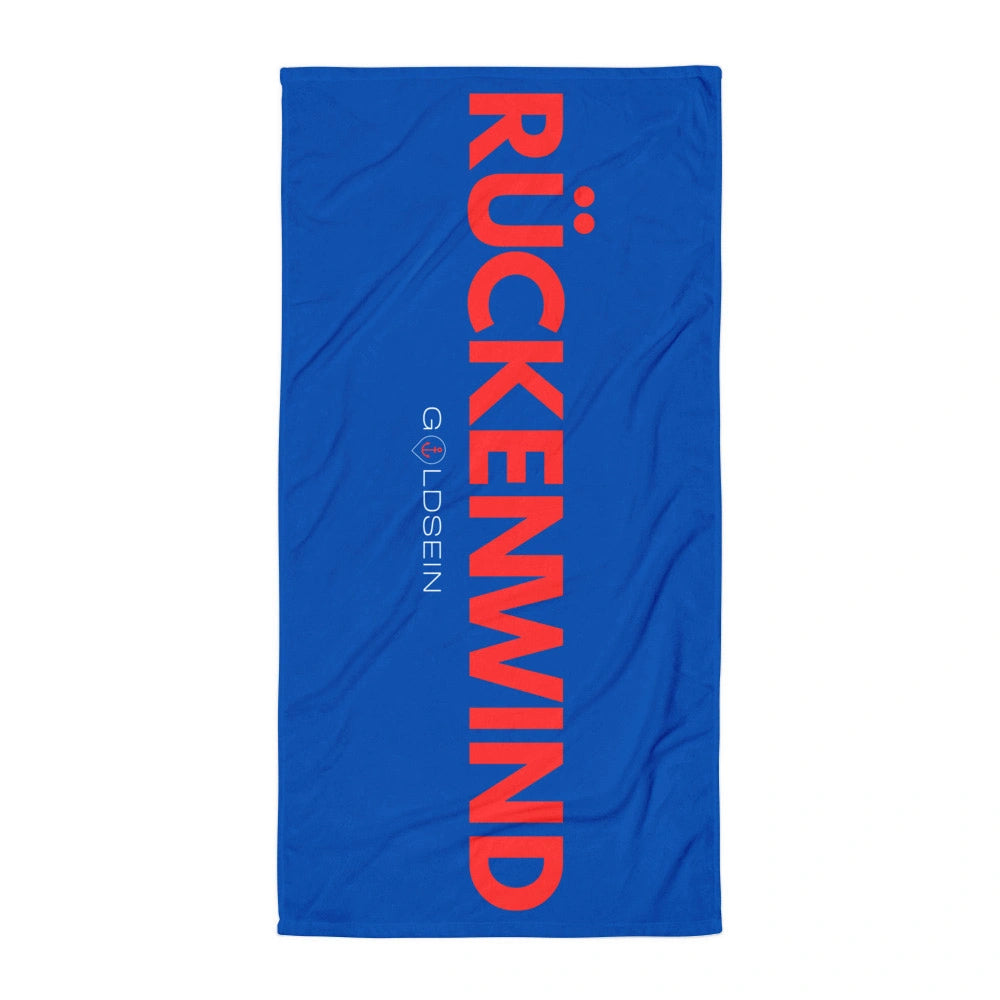 Goldsein Strandtuch "Rückenwind" (Blau/Rot, Vorderseite). So bequem, dass du gar nicht aufstehen willst.