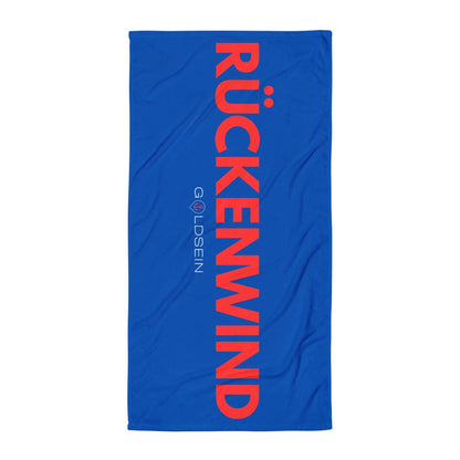 Goldsein Strandtuch "Rückenwind" (Blau/Rot, Vorderseite). So bequem, dass du gar nicht aufstehen willst.