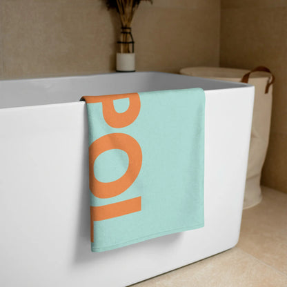 Hochwertiges und weiches goldsein Handtuch "Ruhepol" (Mint/Orange). Perfekt für Strand, Meer und das  Bad.
